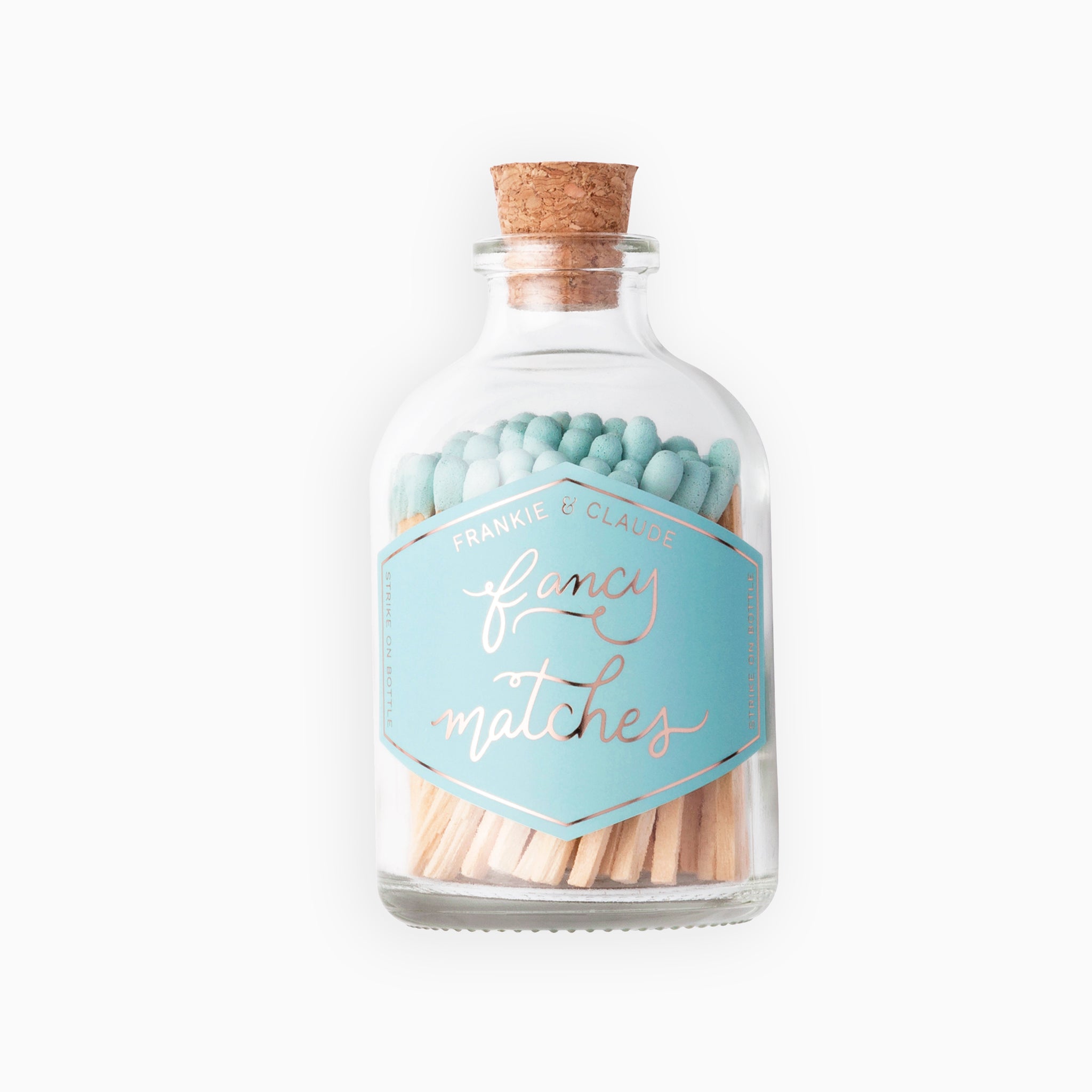 Frankie & Claude’s Small Light Blue Match Jar, featuring a cork top and gold foil label.